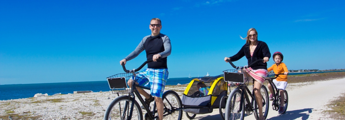 A family bikes while on vacation in Jekyll Island